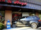 BMW X5 driven by woman crashed into building, 2 people injured BMW X5 driven by woman crashed into building, 2 people injured