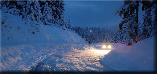 driving a car on a snowy winter road